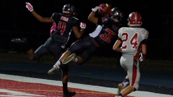 Jake Peralta makes diving interception in the end zone for Clayton Valley of Concord to prevent a Monte Vista of Danville touchdown during game on Friday. Photo: Phillip Walton/SportStars.