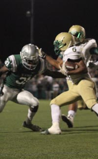 Jarmarqus Robertson and the Long Beach Poly offense found the going tough all night long vs. Obasi Dees and the rest of the De La Salle defense. Photo: Willie Eashman.