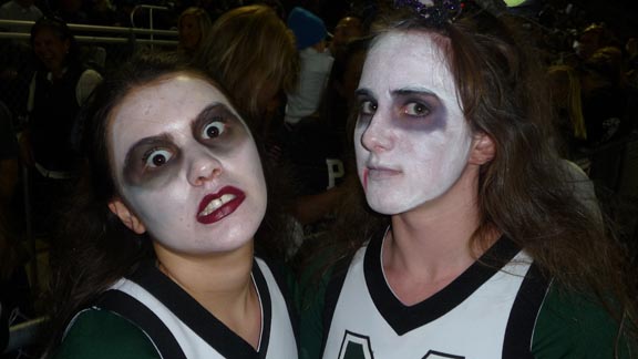 Cheerleaders from Miramonte (Orinda) were turned to zombies before their team even played a down vs. Campolindo of Moraga. On the night before Halloween, there also was a full slate of games played throughout the state. Photo: Mark Tennis.