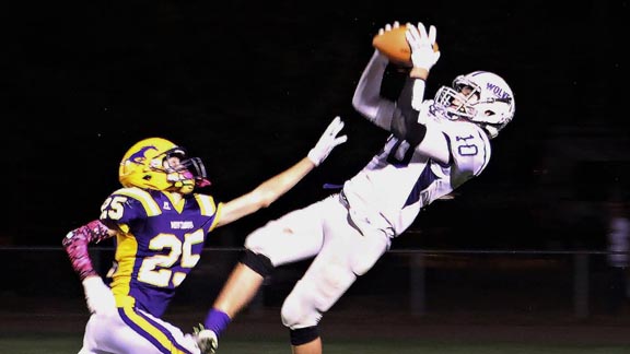 Fort Bragg's Lucas Triplett hauls in one of the 100 catches he had during junior season. Photo: Brittaney Dondanville.