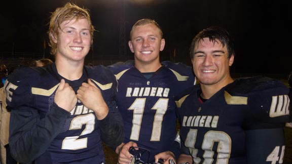 Backfield mates Justin Rice, Hunter Petlansky and Kekupua'a Freehof were happy after Friday win against previously unbeaten Oakdale. Photo: Mark Tennis.