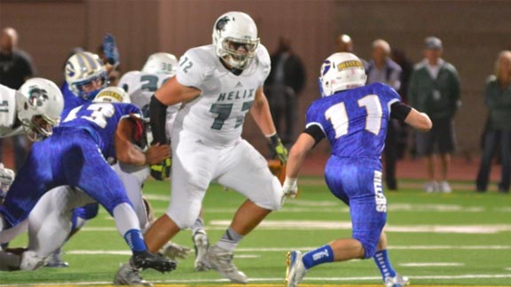 Helix lineman Mario Bernal, a 6-foot-3, 304-pound junior, looks to tackle Grossmont's Christopher Laethem during game last Friday. Photo: Ramon Scott/EastCountySports.com.