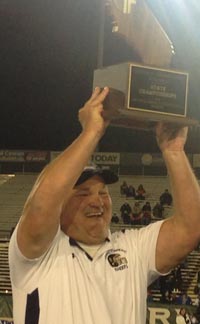 Central Catholic head coach Roger Canepa hoists fourth consecutive CIF state title. Photo: Paul Muyskens.