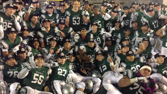 It's a familiar scene to end the California prep football season with De La Salle of Concord players sliding in the end zone and then getting team photo after winning CIF Open Division state bowl game. Photo: Paul Muyskens.