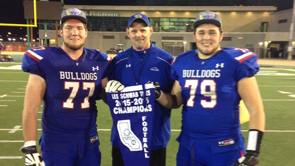 Folsom head coach Kris Richardson is flanked by graduated linemen Jonah Williams (left) and his son, Kooper Richardson, following team's win last year vs. Elk Grove. Photo: Paul Muyskens.