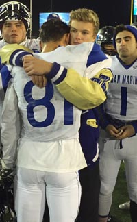 San Marino WR J.P. Shohfi hugs longtime best friend Carson Glazier after loss to Central Catholic. Glazier, who has thrown most of the passes in Shohfi's state-record breaking season, couldn't play due to concussion protocols. Photo: Mark Tennis.
