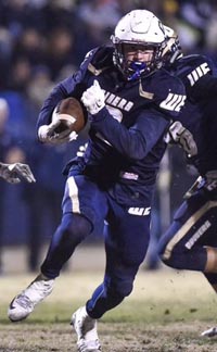 Justin Rice churns for some of the 328 yards he had Saturday night vs. Marin Catholic. Photo: Andy Alfaro/The Modesto Bee.