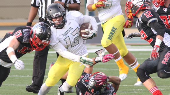 Harbor City Narbonne QB Roman Ale gets hit during scramble against Concord Clayton Valley in CIF D1-A state bowl game. Photo: Willie Eashman.