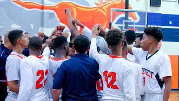 Players at Roosevelt of Eastvale are about to break huddle during win last week over Corona Centennial that helped team move into State Top 20. Photo: @nikobeats/Twitter.com.