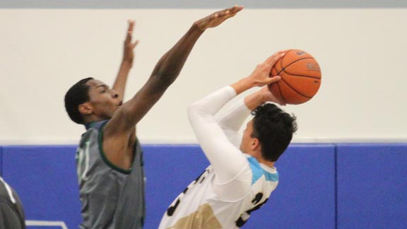 Freshman center Onyeka Okongwu gets ready to block a shot during Chino Hills' 71-66 victory on Saturday night over Bishop Montgomery of Torrance. Photo: Andrew Drennen.