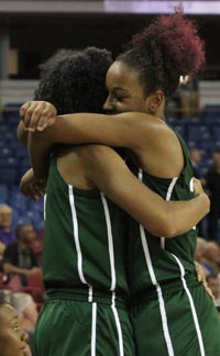 Kayla Washington (right) hugs teammate after Cajon girls won CIF Division II state title. Photo: Willie Eashman.