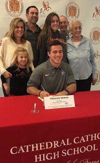 Hogan Irwin signs letter of intent with family surrounding him last month. Photo: @KUSISports/Twitter.com.