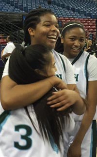 Iimari'I Thomas wraps her arms around a teammate after Sacred Heart Cathedral topped Lakeside in D3 state final. Photo: Mark Tennis.