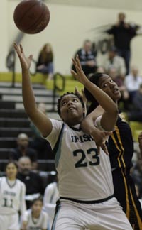 Ilmar'I Thomas of S.F. Sacred Heart Cathedral eyes rebound as she is grabbed during D3 NorCal final vs. Inderkum. Photo: Willie Eashman.