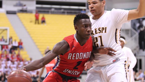 Redondo's Leland Green has his path blocked by Crespi's Anthony Booker during CIF Division I SoCal final at Long Beach State. Photo: Andrew Drennen.