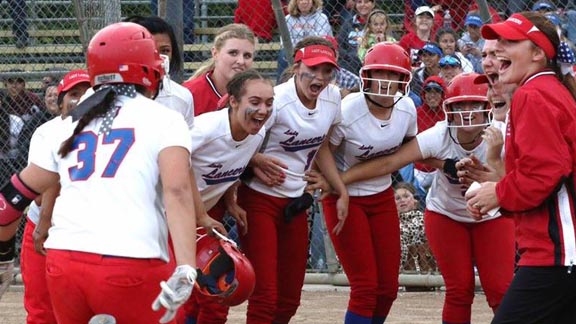 Alejandra Rascon (37) is about to get mobbed at home plate for East Union of Manteca after hitting walk-off three-run homer last week vs previously unbeaten Oakdale. Photo: Sean Kahler.