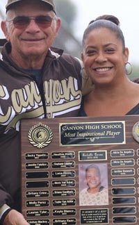 Former Canyon of Anaheim coach Lance Eddy stands with Stephanie, sister of the namesake of the Michelle Carew Classic softball tourney. We once put Stephanie (daughter of Rod Carew) on the cover of Student Sports' national magazine. Photo: OCSidelines.com.