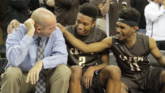 Encino Crespi head coach Russell White jokes around with players Brandon Williams (2) and Taj Regans (11) during team's CIF Division I state title season. Photo: James Escarcega.