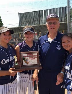 Jim Liggett of Carlmont and three of his players pose with runner-up trophy after CCS Division I title game. Photo: Harold Abend.