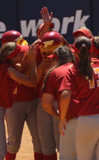 Taylor Roberts of Lancaster Paraclete gets mobbed at home plate after go-ahead homer in CIFSS D6 final. Photo: Patrick Takkinen/OCSidelines.com.