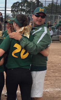 Tony Williams looks away briefly from group hug with players after team won CIF Sac-Joaquin Section Division VI title. Photo: Mark Tennis.