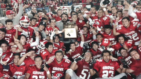 Players and coaches from Garden Grove's 2014 CIFSS Southern Division title team celebrate after finals' win vs. Rancho Alamitos. Photo: Jason Eichelberger/SoCalSidelines.com.