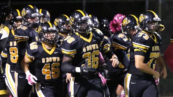 Bishop O'Dowd of Oakland football players run onto the field before a game last season against San Leandro. The two teams could be playing for a league championship when they meet this season on November 4. Photo: Ela Blalek/bishopodowd.org.