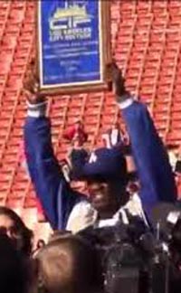 L.A. High head coach Eric Scott celebrates with section title plaque. Photo: Twitter.com.