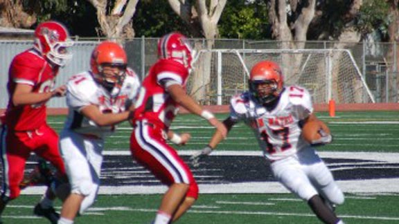 San Mateo and Burlingame players battle it out during recent year of rivalry series. The first game between the two schools was played in 1927. Photo: thebearcat.net.