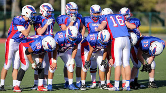 Players from Tamalpais of Mill Valley get ready to break their huddle in recent game. Photo: VarsityPix.com.
