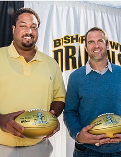 Langston Walker and Eric Bjornson received golden footballs that were given to O'Dowd earlier this year in celebration of the 50th Super Bowl. They both played in the game. Photo: bishopodowd.org.