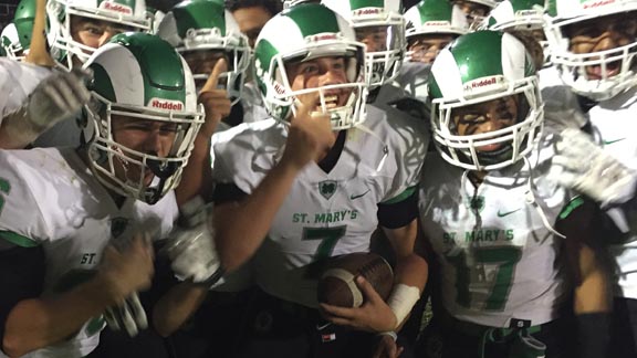 Jake Dunniway (No. 7) and Dewey Cotton (No. 17) are two of the St. Mary's of Stockton players celebrating after team's win vs. Central Catholic of Modesto. Photo: Mark Tennis.