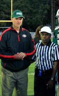 Jim Harbaugh prepares to do a coin flip before a Palo Alto High football game when he was head coach of the San Francisco 49ers. Photo: palyvoice.com.