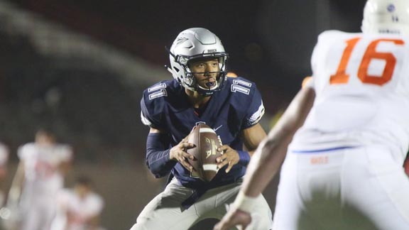 QB Re-al Mitchell of Bellflower St. John Bosco eyes defense of Las Vegas Bishop Gorman during Friday's game tween nationally ranked teams. Photo: Patrick Takkinen/SoCalSidelines.com.