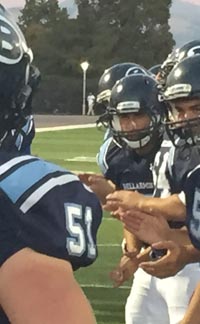 Bellarmine players line up to greet starter Nicolas Bowes (51) before start of game vs. St. Francis. Photo: Mark Tennis.