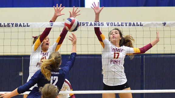 Emily Fitzner & Daniela Fornaciari of state-ranked and nationally ranked San Diego Torrey Pines defend the net in recent match. Photo: Anna Scipione/@TorreyPinesHS.