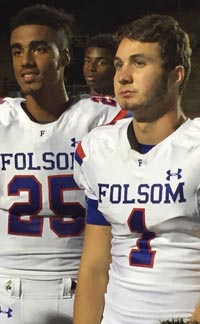 Folsom QB Joe Curry (No. 1) listens to head coach Kris Richardson talk to thhe team after game against Del Oro. Photo: Mark Tennis.