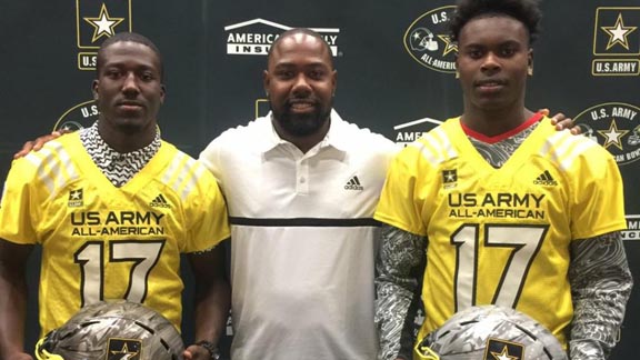 Hawkins of L.A. head coach Milvon James is flanked by the school's two U.S. Army All-Americans -- Greg Johnson (left) and Joseph Lewis (right). The team, favored in the CIF L.A. City Division II playoffs, already has won a big game this week 24-21 vs. Dorsey. Photo: Hawkins High football.