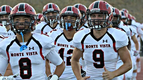 Players Andy Yi (8) and Cole Ames (9) from No. 13 Monte Vista of Danville trot onto the field before recent game this season. Photo: MVHSMustangs/Facebook.com.