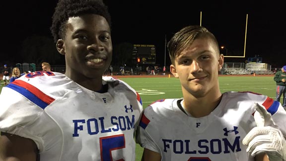 Folsom's Ariel Ngata (left) and Brad Jenner both made key plays on both sides of the ball when the Bulldogs rolled past Del Oro of Loomis. Photo: Mark Tennis.