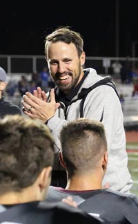 Woodcreek co-head coach Kyle Stowers is all smiles after team defeated Rocklin last Friday. Photo: Woodcreek Timberwolves Football/Facebook.com.
