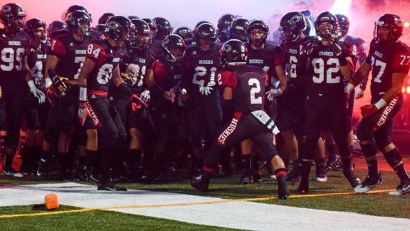 Centennial of Corona players get ready to take the field before they played IMG Academy earlier this season at Honor Bowl. Photo: centennialhuskyfootball.com.