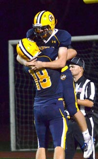 Evan King of Menlo School celebrates one of his TDs from recent game. Photo: Pam Tso McKenney/coa.menloschool.org.