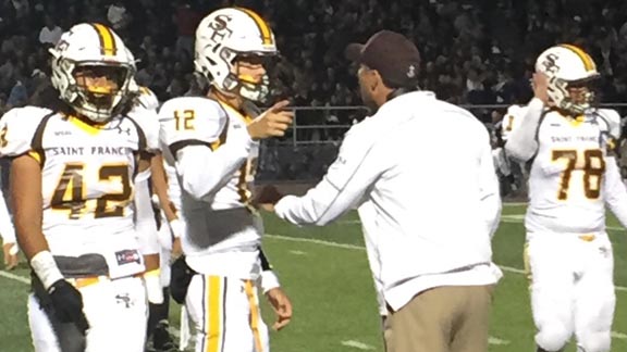 St. Francis of Mountain View QB Reed Vettel gets instruction from head coach Greg Calcagno during game against Bellarmine Prep of San Jose. Photo: Mark Tennis.