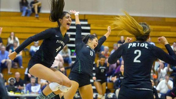 Pitman of Turlock players Kaylin Randhawa (4), Kiyanna Torres (11) and Yisel Perez (2) go nuts after team won third straight section title. Photo: John Westburg/The Modesto Bee.