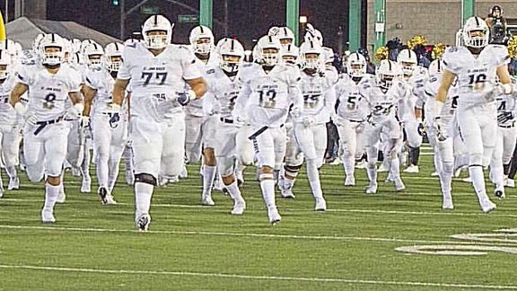 St. John Bosco players hit the field for the opening kickoff in their final game of 2016 season last Saturday at Sacramento State against De La Salle. Photo: Twitter.com.