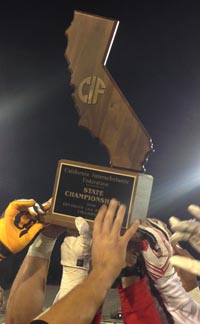 It's a swarm of Cathedral Catholic hands as CIF state title trophy is presented. Photo: Paul Muyskens.