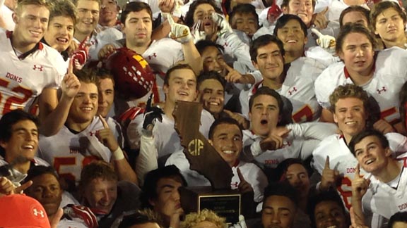 Players from San Diego Cathedral Catholic get a little crazy with CIF Division I-AA state championship trophy after improbable and stunning win vs. St. Mary's. Photo: Paul Muyskens.