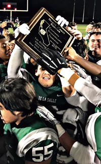 De La Salle players fight to get their hands on CIF North Coast Section title trophy after Friday's win vs. Freedom of Oakley. Photo: Twitter.com.