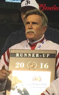 Mater Dei head coach Bruce Rollinson accepts runner-up plaque after last week's CIF Southern Section Division I title game. Photo: Mark Tennis.